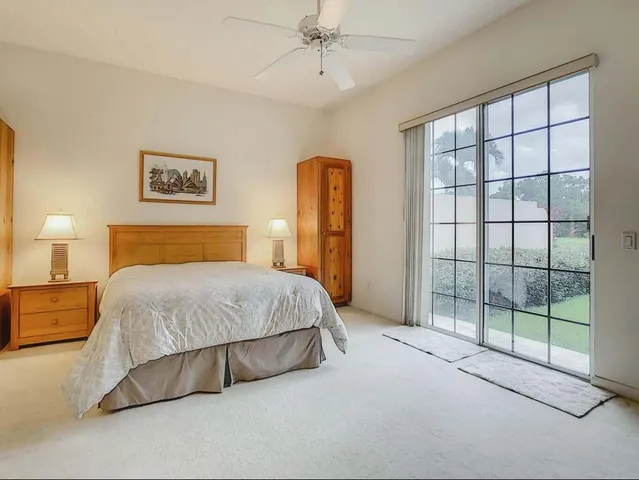 a bedroom with two beds and a chandelier