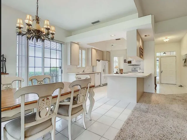 a living room with furniture and a lamp