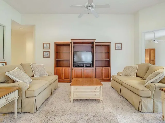 a living room with furniture and a table