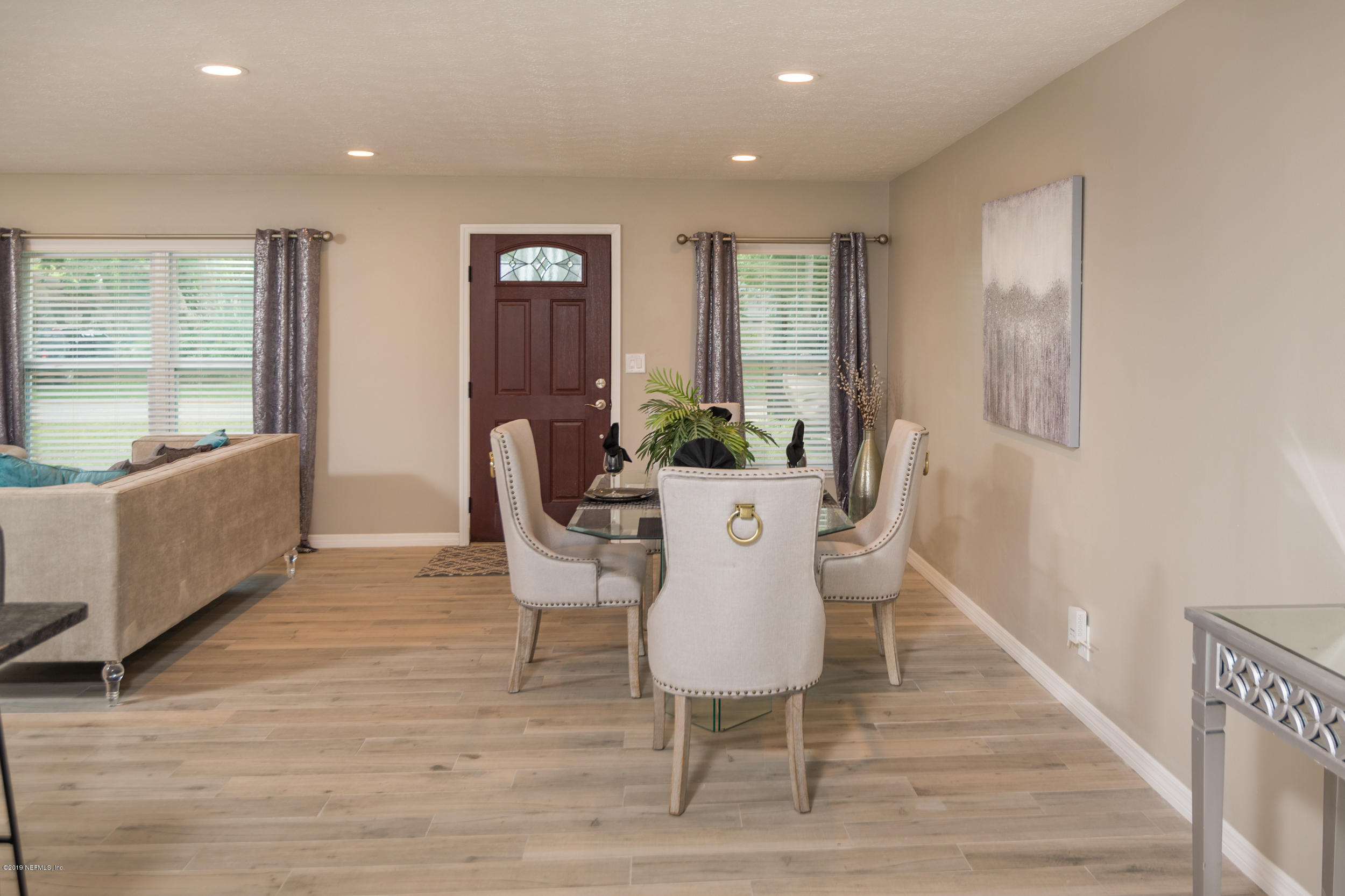 130 Tanager Road St. Augustine, FL 32086 - Photo 8 of 63 a dining room with furniture and wooden floor