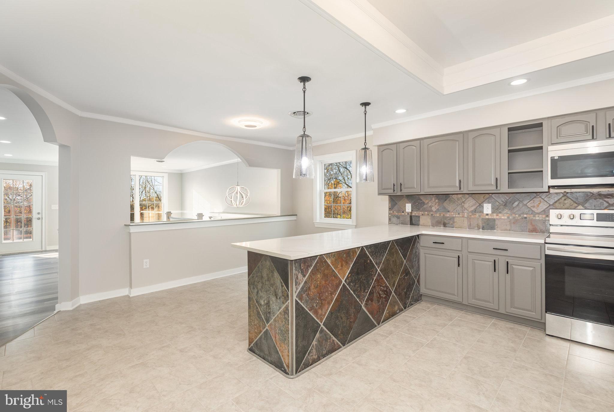 481 Sample Bridge Road Enola, PA 17025 - Photo 20 of 55 a kitchen with stainless steel appliances a sink stove and cabinets