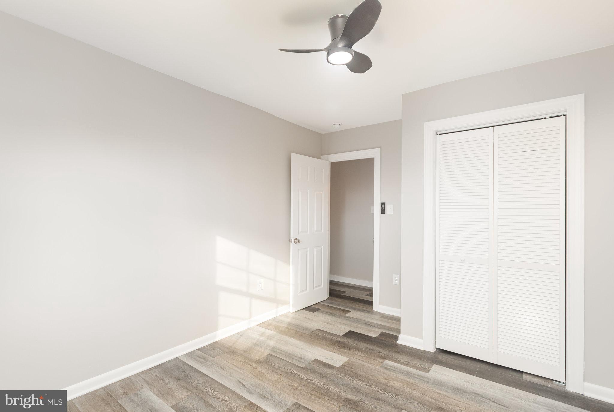 481 Sample Bridge Road Enola, PA 17025 - Photo 29 of 55 an empty room with wooden floor and ceiling fan