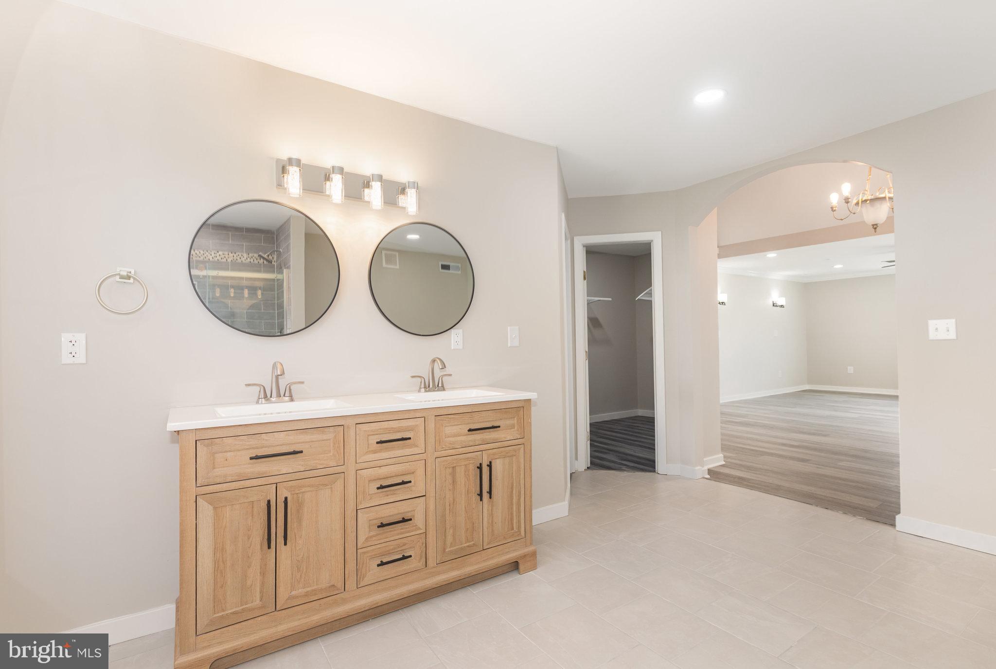 481 Sample Bridge Road Enola, PA 17025 - Photo 35 of 55 a bathroom with a double vanity sink and a mirror
