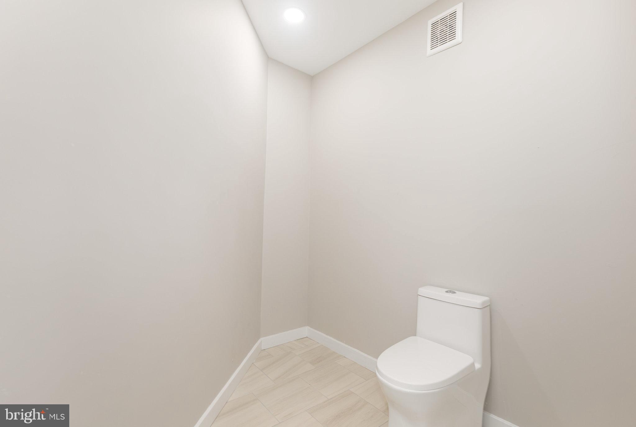 481 Sample Bridge Road Enola, PA 17025 - Photo 36 of 55 a white toilet sitting next to a white wall