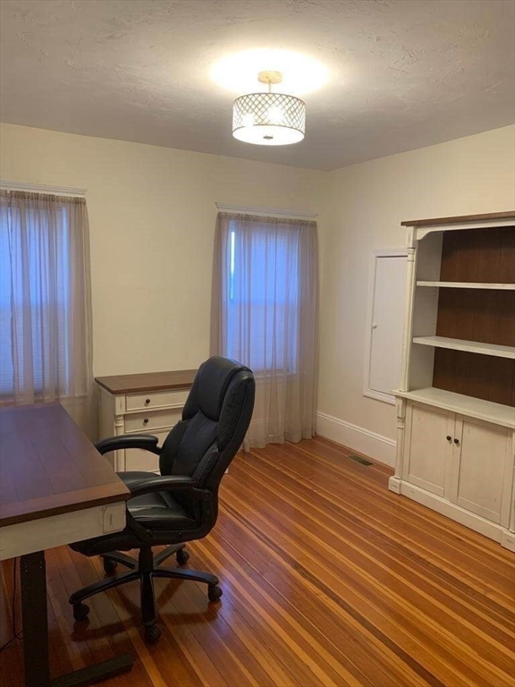 348 School Street, Unit 348 Watertown, MA 02472 - Photo 12 of 15 a living room with furniture and a window