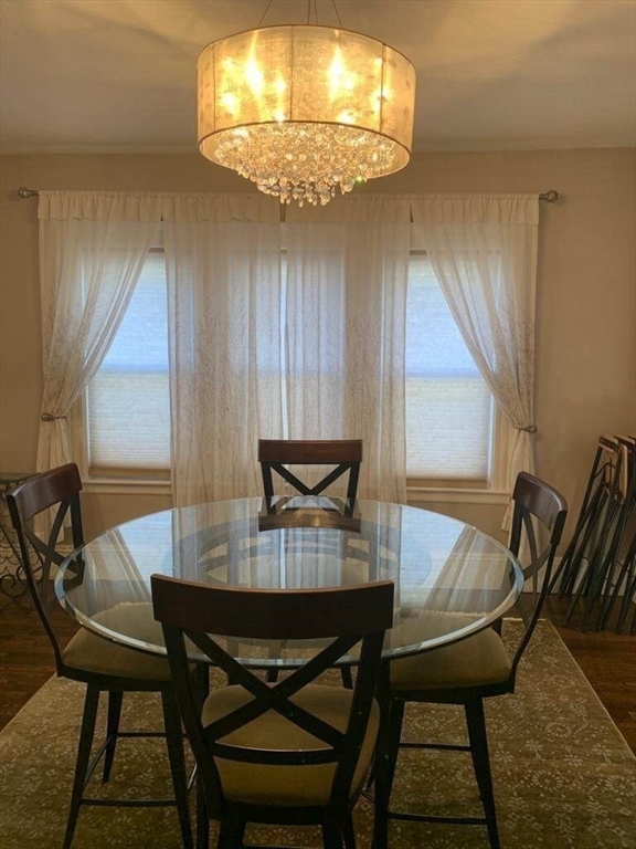 348 School Street, Unit 348 Watertown, MA 02472 - Photo 4 of 15 a view of a dining room with furniture and chandelier