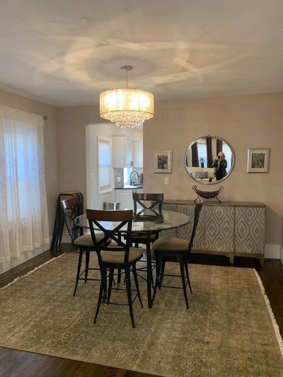 348 School Street, Unit 348 Watertown, MA 02472 - Photo 6 of 15 a view of a dining room with furniture and chandelier