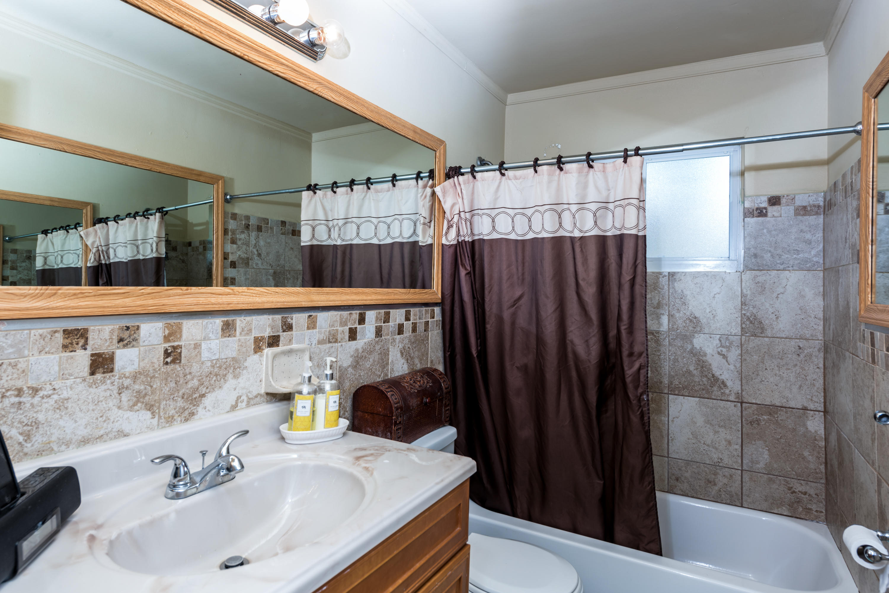 455 Northeast 37th Street Boca Raton, FL 33431 - Photo 12 of 19 a bathroom with a sink and a shower