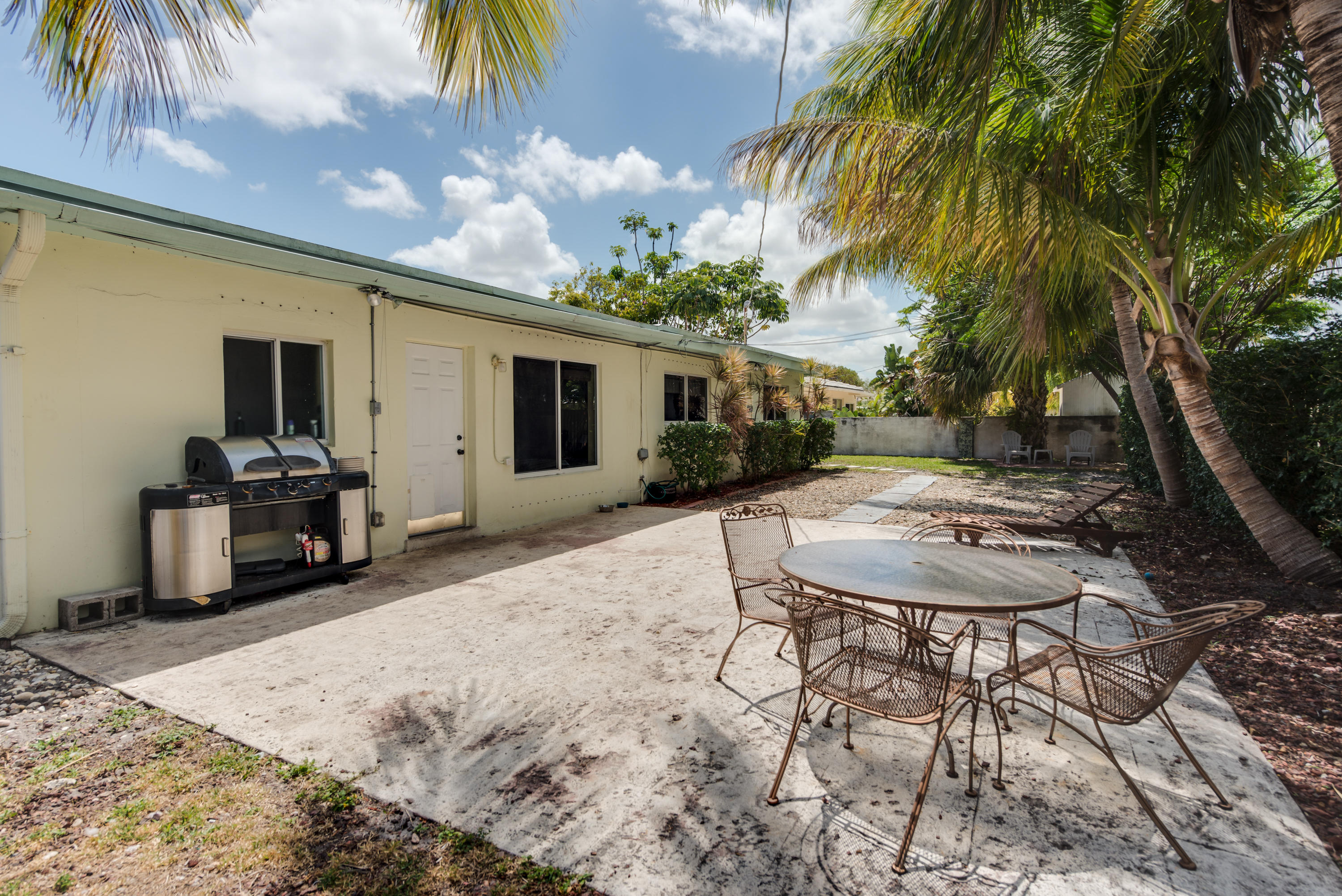 455 Northeast 37th Street Boca Raton, FL 33431 - Photo 15 of 19 a view of a house with backyard and sitting area