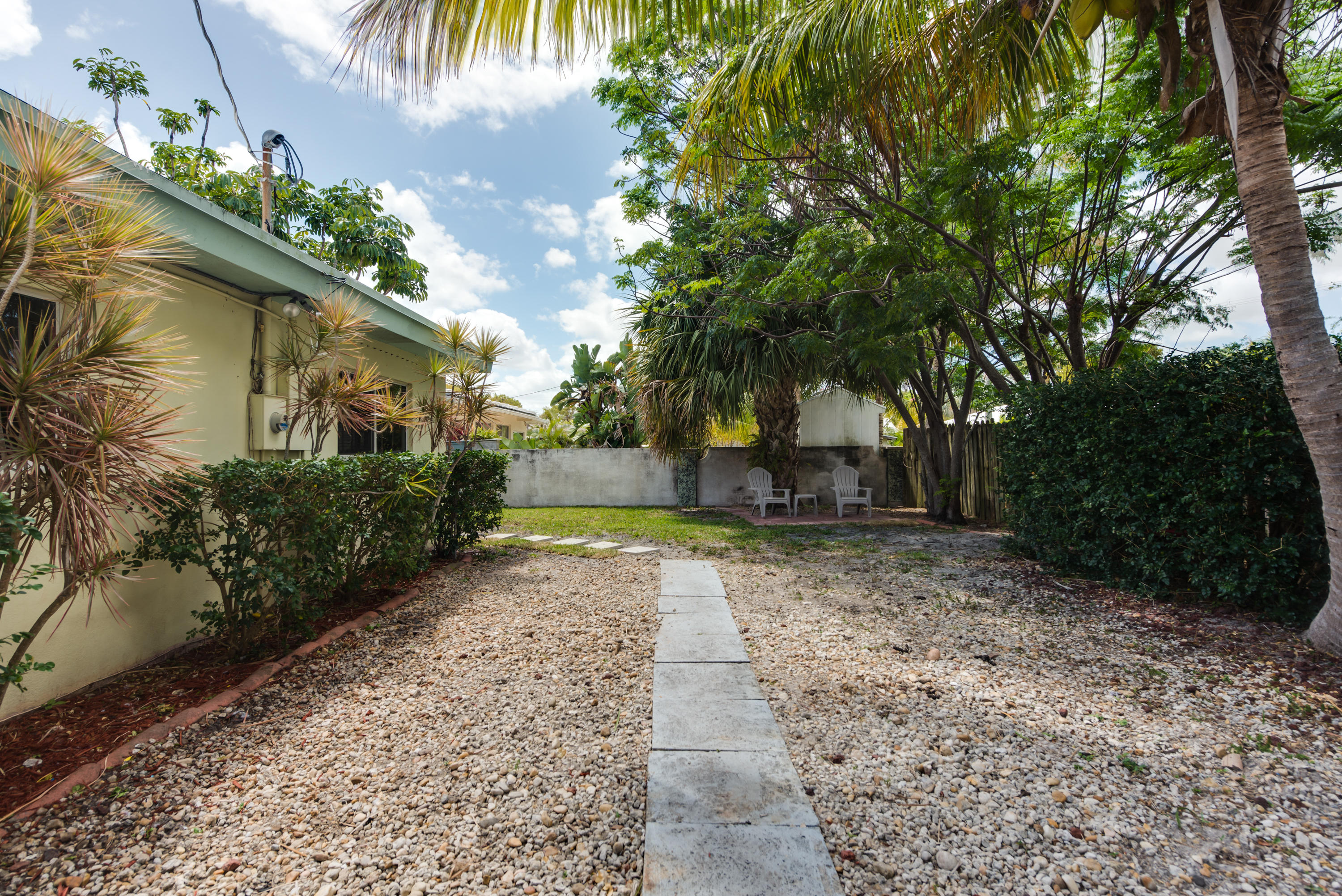 455 Northeast 37th Street Boca Raton, FL 33431 - Photo 16 of 19 a view of a yard with plants and trees