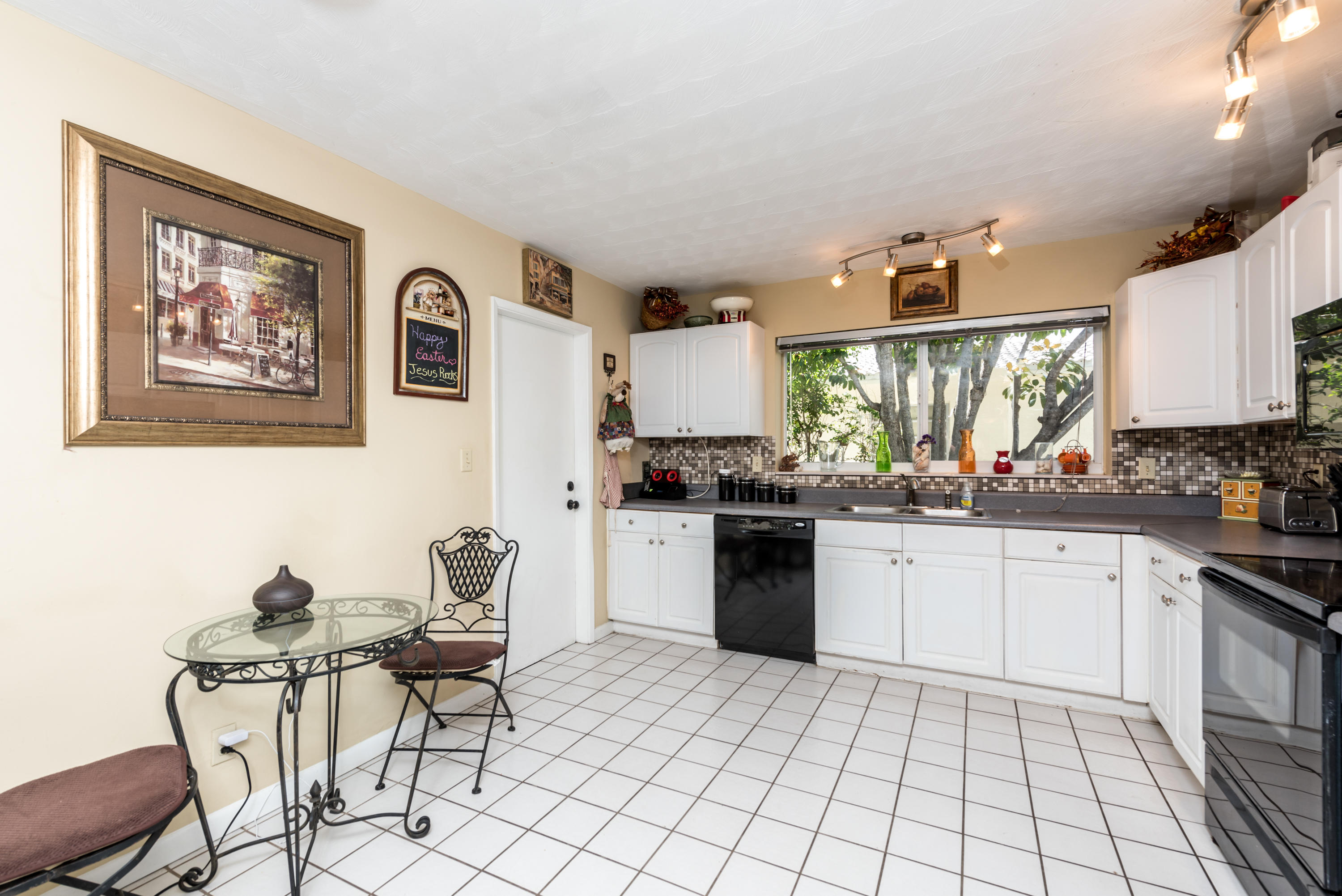 455 Northeast 37th Street Boca Raton, FL 33431 - Photo 6 of 19 a kitchen with a sink cabinets and window