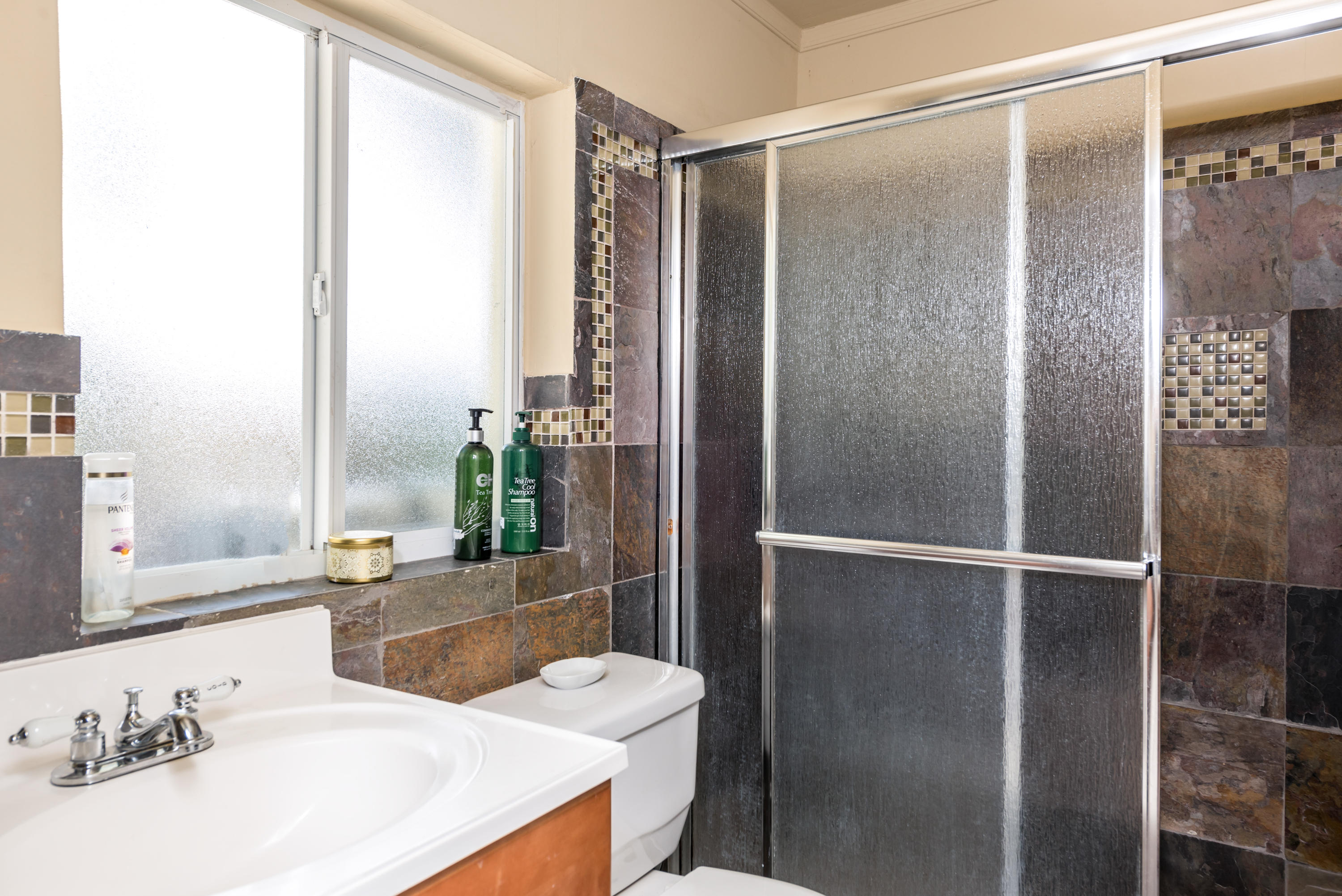 455 Northeast 37th Street Boca Raton, FL 33431 - Photo 10 of 19 a bathroom with a sink and a mirror