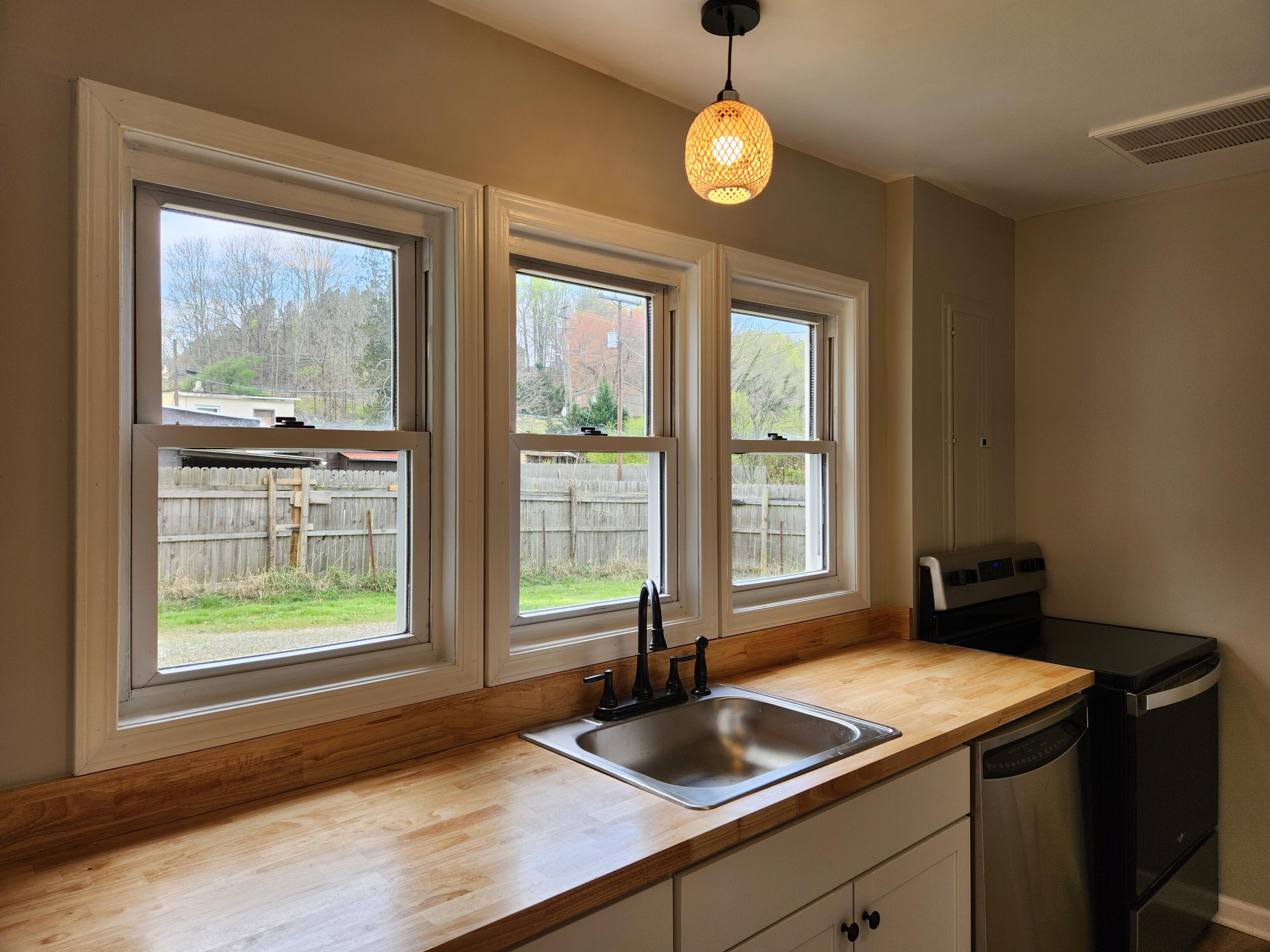 101 Union Road Ferrum, VA 24088 - Photo 11 of 41 a kitchen with a large window and a sink