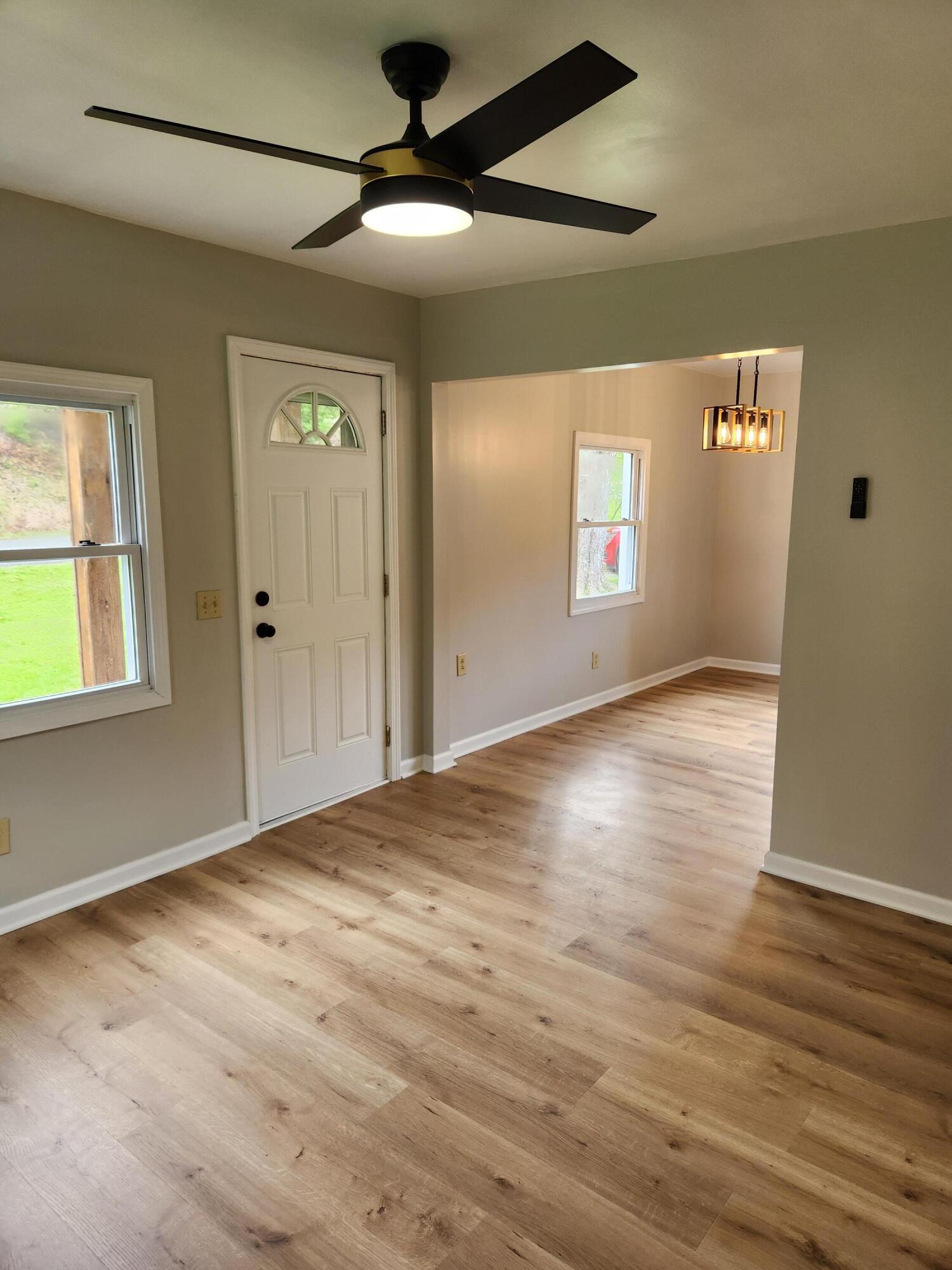 101 Union Road Ferrum, VA 24088 - Photo 15 of 41 en empty room with wooden floor and windows