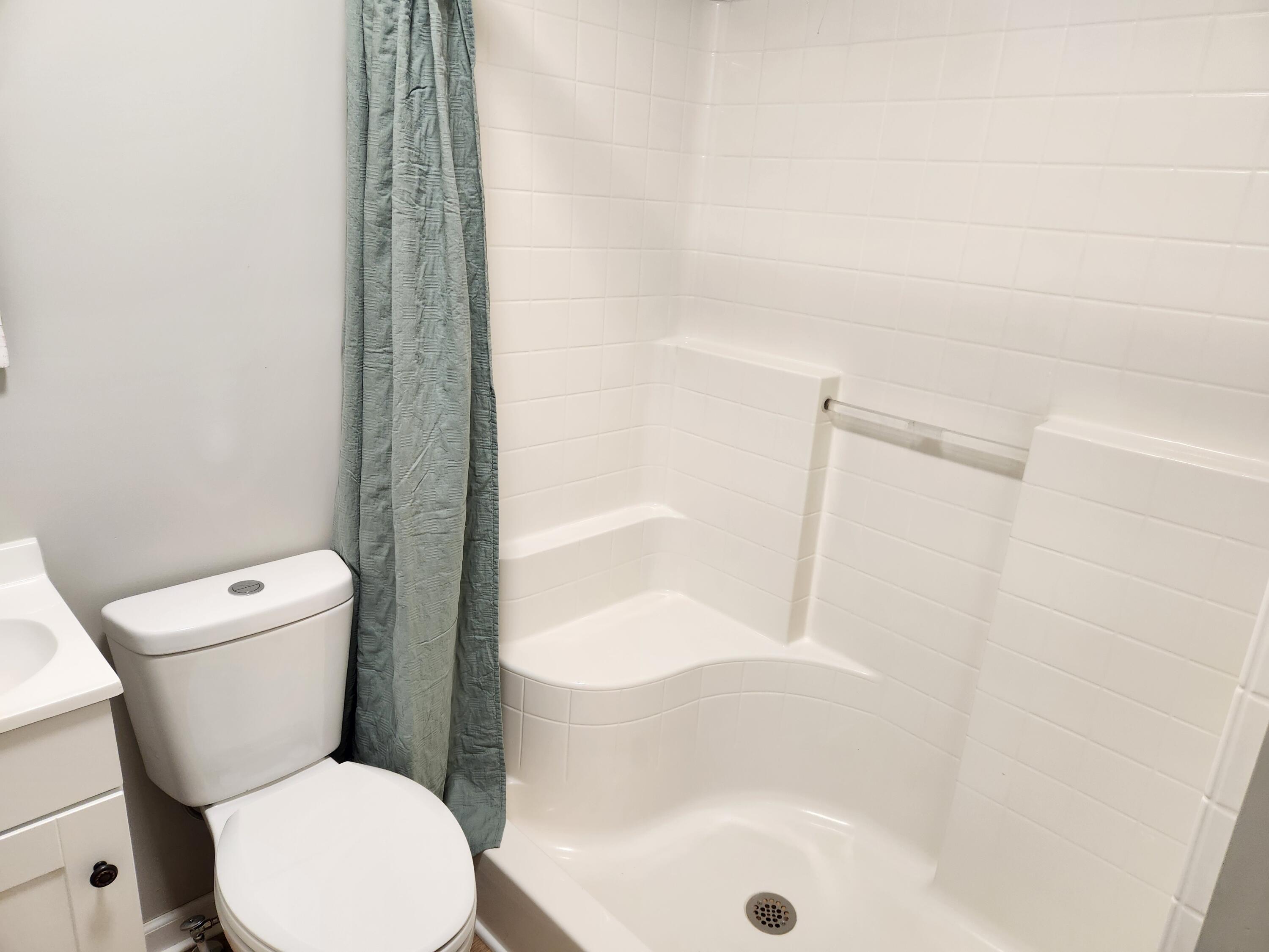 101 Union Road Ferrum, VA 24088 - Photo 23 of 41 a white toilet sitting next to a bath tub