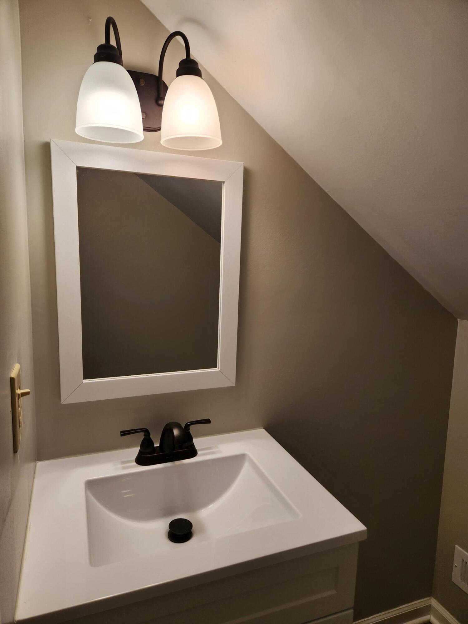 101 Union Road Ferrum, VA 24088 - Photo 33 of 41 a bathroom with a sink and a mirror