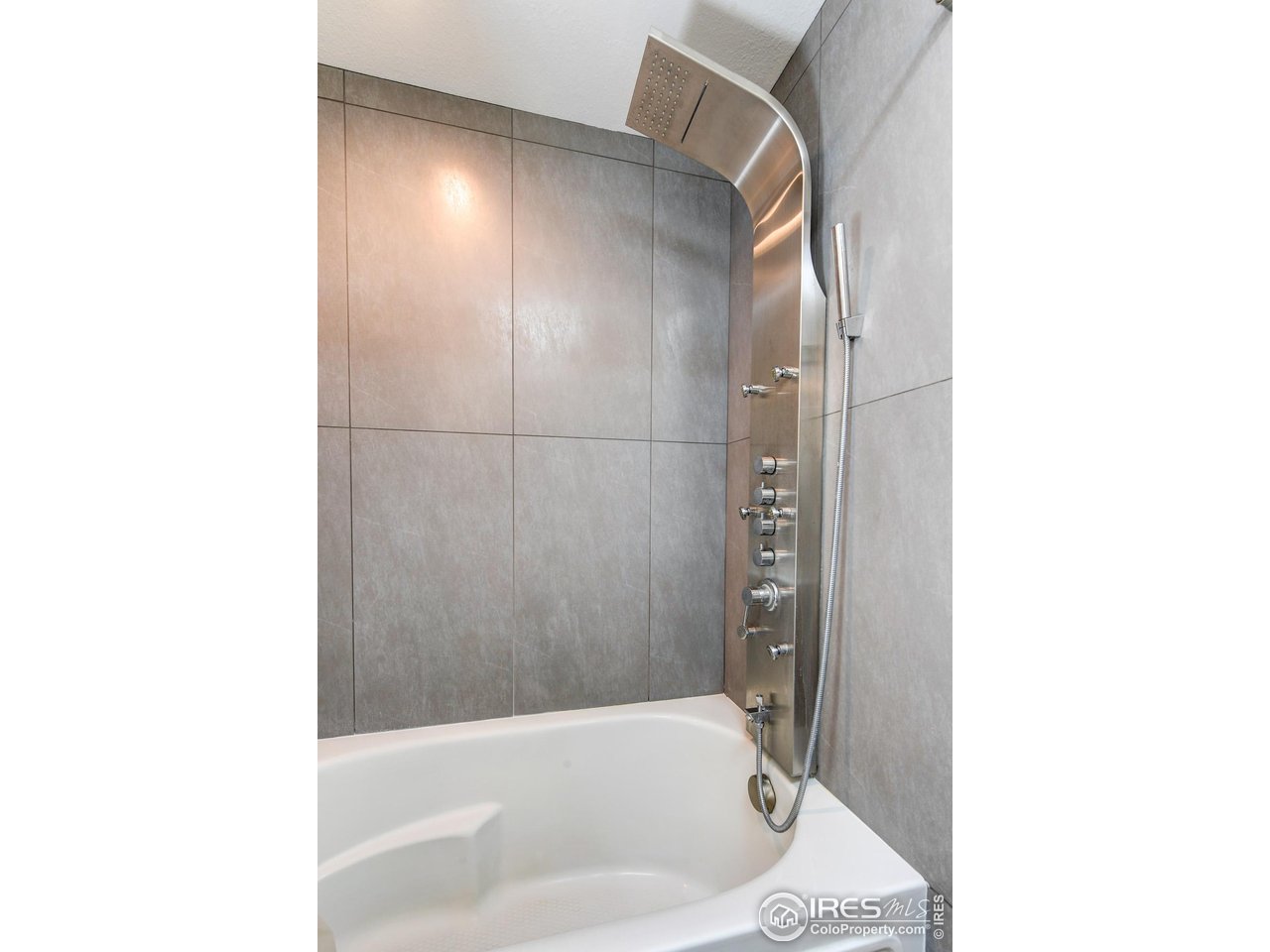 3025 Broadway, Unit 10 Boulder, CO 80304 - Photo 13 of 20 a bathroom with a bathtub and a shower