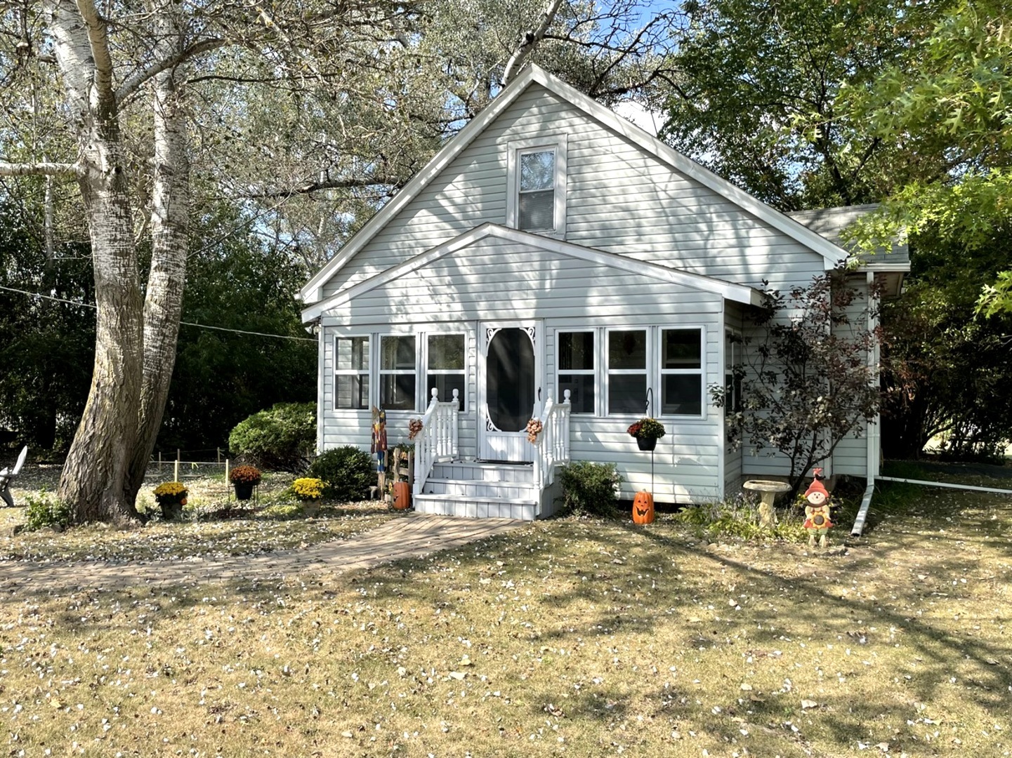 a front view of a house with sitting area