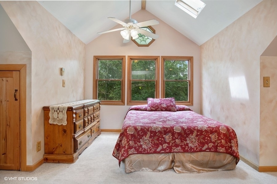 8808 Bard Road Crystal Lake, IL 60014 - Photo 11 of 32 a bedroom with a bed and a window