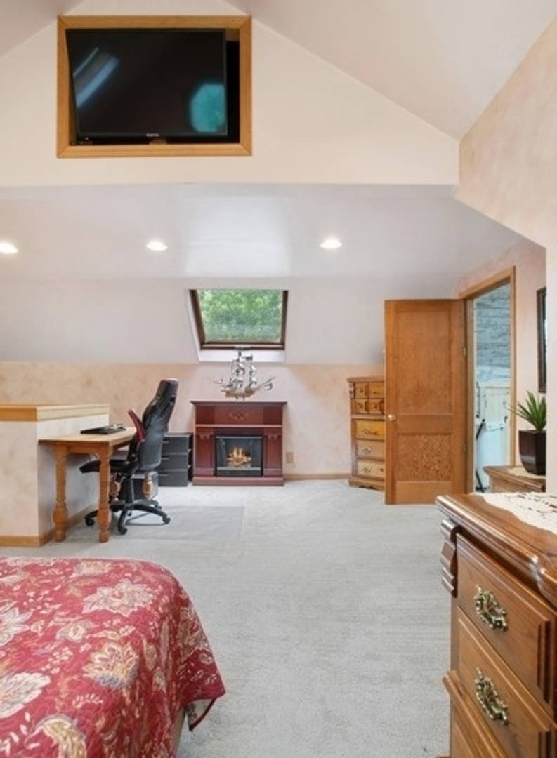 8808 Bard Road Crystal Lake, IL 60014 - Photo 12 of 32 a bed room with a bed and a television