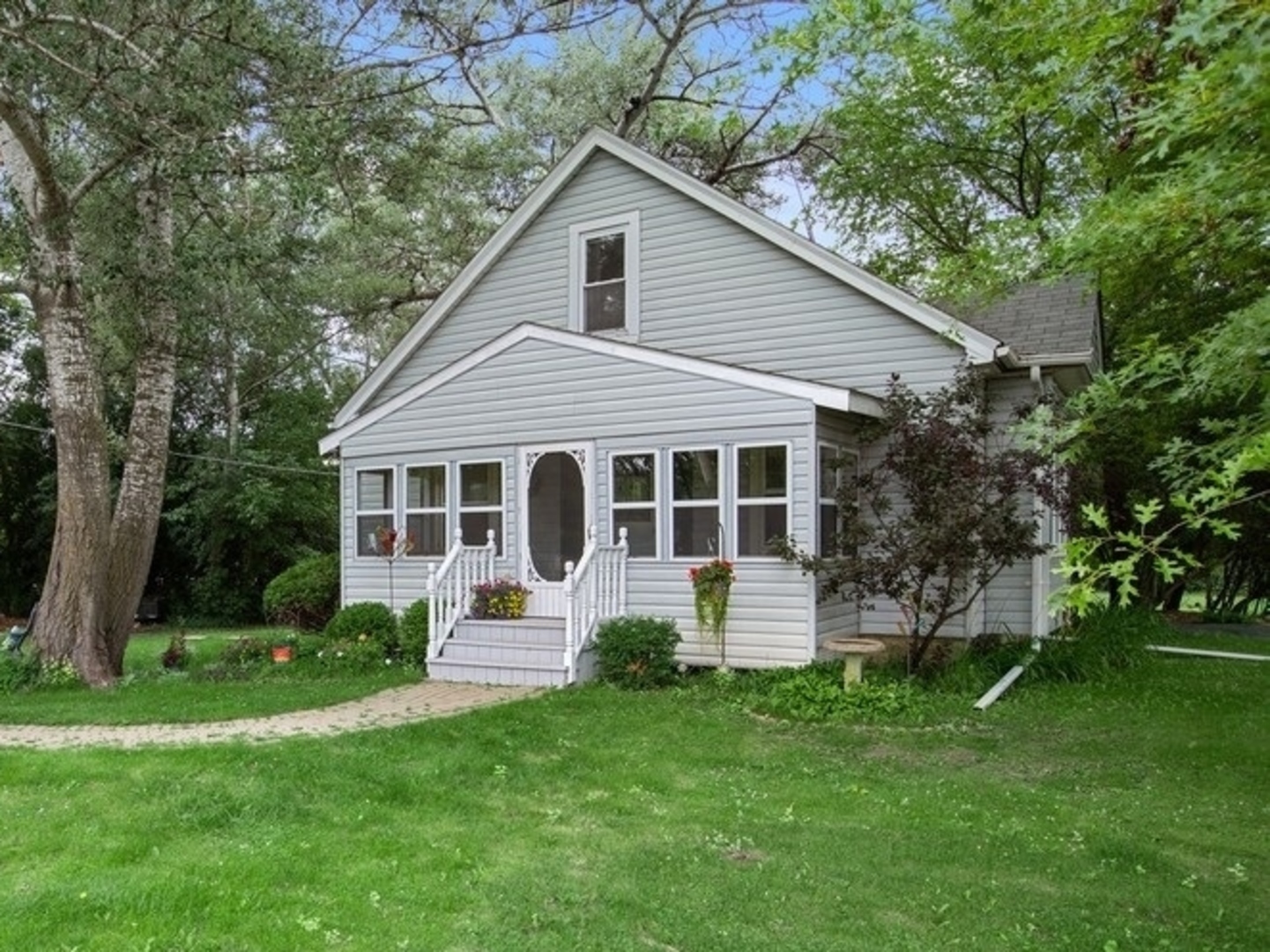 8808 Bard Road Crystal Lake, IL 60014 - Photo 13 of 32 a front view of house with yard and green space