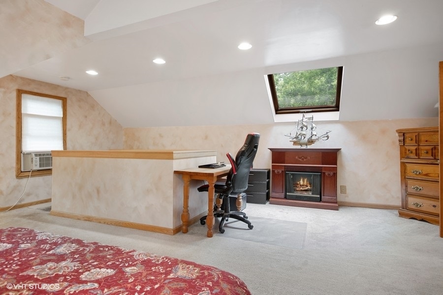 8808 Bard Road Crystal Lake, IL 60014 - Photo 15 of 32 a living room with furniture and a fireplace