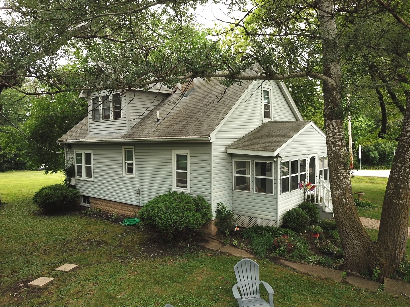 8808 Bard Road Crystal Lake, IL 60014 - Photo 28 of 32 a front view of a house with garden