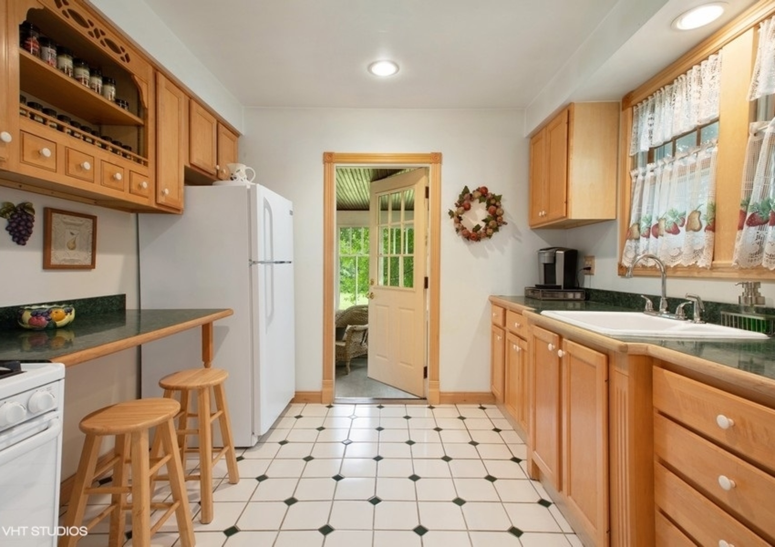 8808 Bard Road Crystal Lake, IL 60014 - Photo 5 of 32 a kitchen with stainless steel appliances a stove a sink and a refrigerator