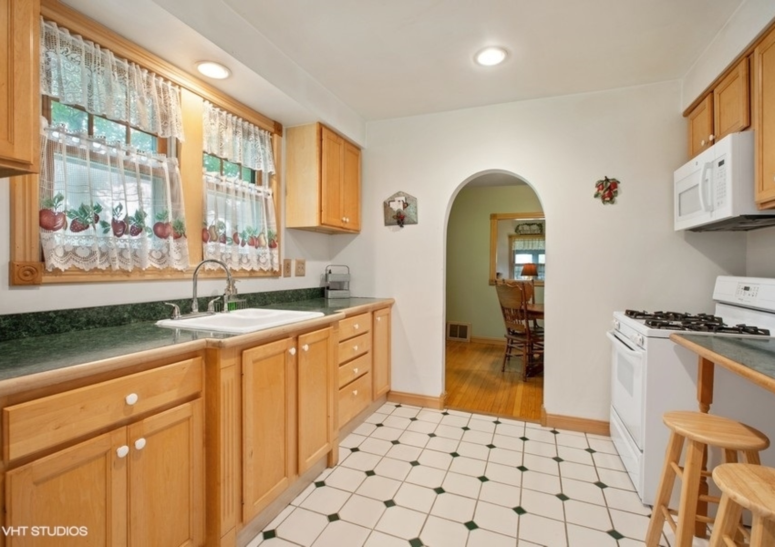 8808 Bard Road Crystal Lake, IL 60014 - Photo 6 of 32 a kitchen with stainless steel appliances a stove a sink and a refrigerator