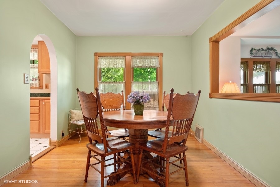 8808 Bard Road Crystal Lake, IL 60014 - Photo 7 of 32 a dining room with furniture window wooden floor