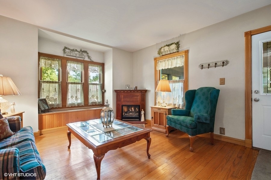 8808 Bard Road Crystal Lake, IL 60014 - Photo 9 of 32 a living room with furniture and a fireplace