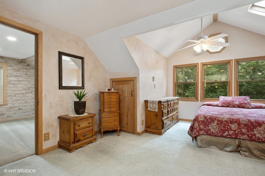 8808 Bard Road Crystal Lake, IL 60014 - Photo 10 of 32 a spacious bedroom with bed and a large window
