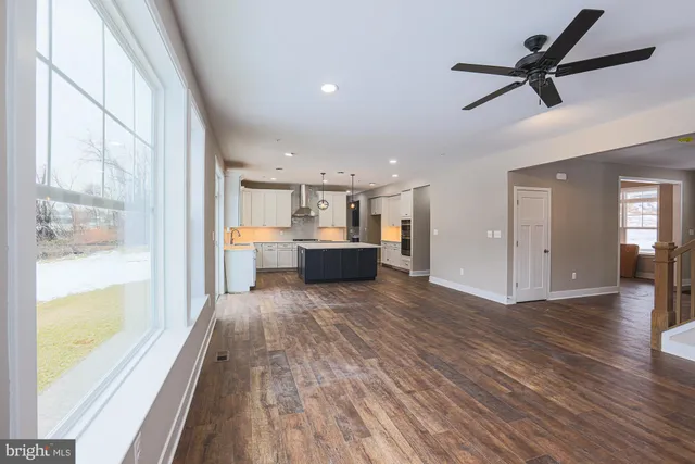 a view of a room with wooden floor and cabinet