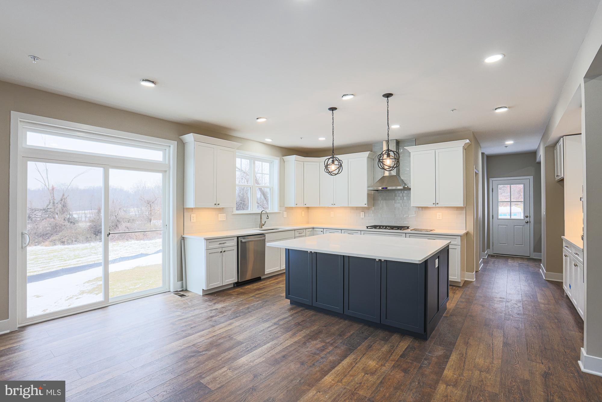 4712 Carroll Manor Road Baldwin, MD 21013 - Photo 20 of 69 a large kitchen with a lot of counter space and wooden floor
