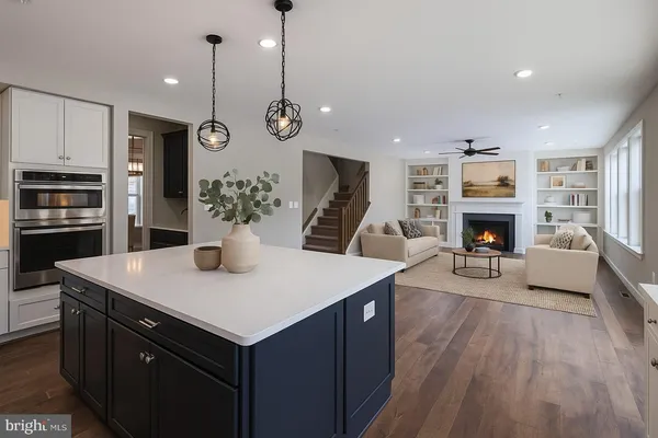 a bedroom with furniture and a wooden floor