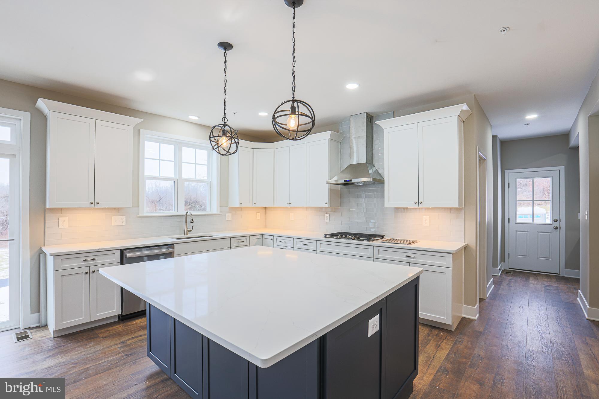 4712 Carroll Manor Road Baldwin, MD 21013 - Photo 21 of 69 a kitchen that has a lot of cabinets in it and wooden floors