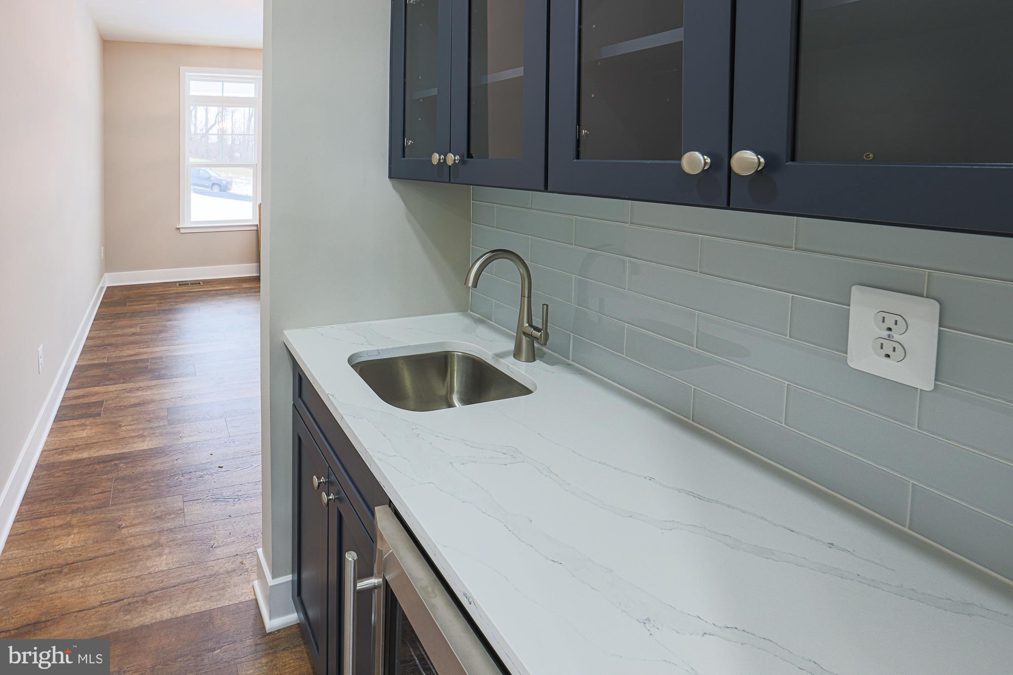 4712 Carroll Manor Road Baldwin, MD 21013 - Photo 32 of 69 a kitchen with a sink and cabinets