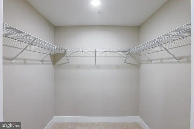 a bathroom with a bathtub a shower a sink and a large mirror