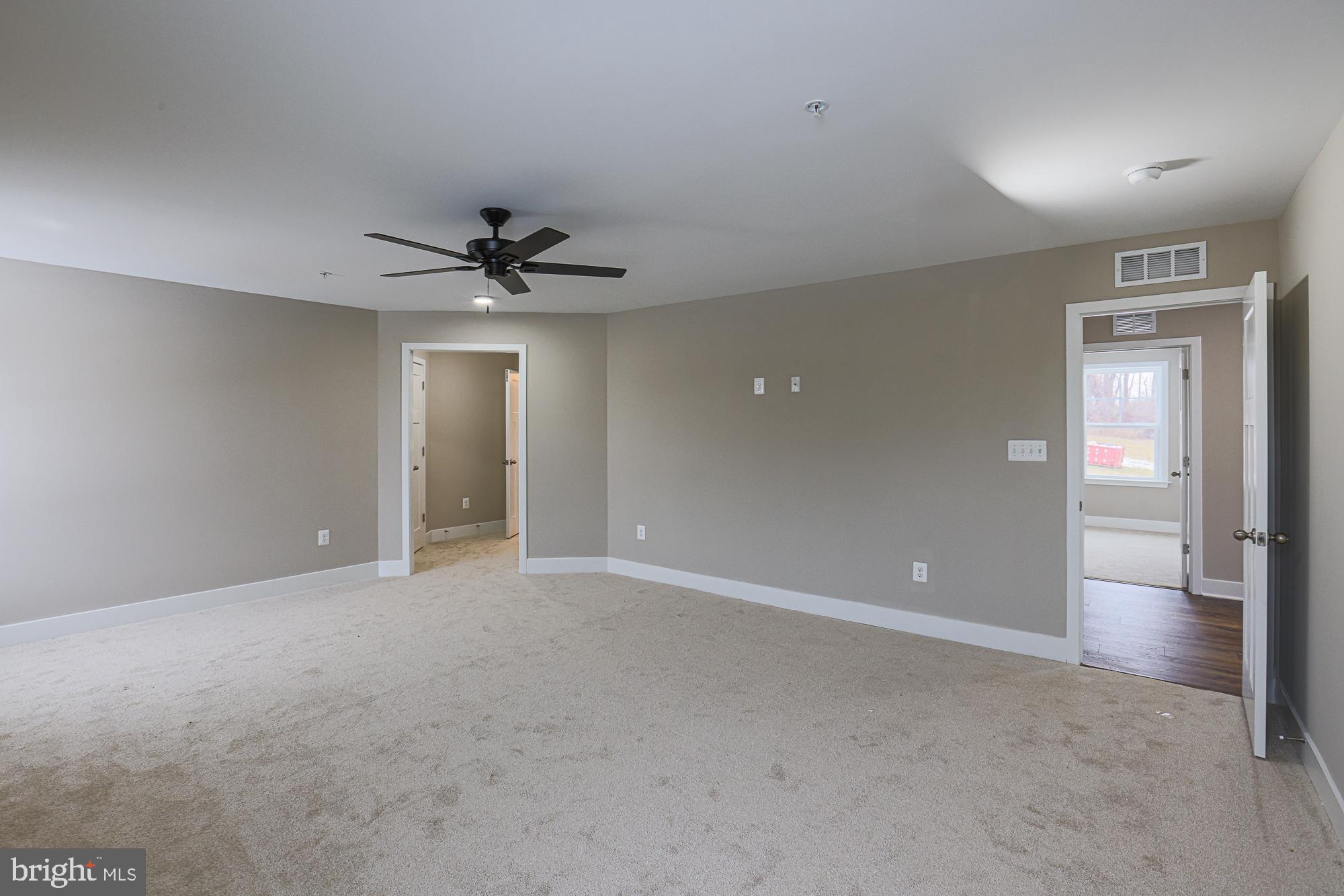 4712 Carroll Manor Road Baldwin, MD 21013 - Photo 44 of 69 wooden floor in an empty room and a ceiling fan