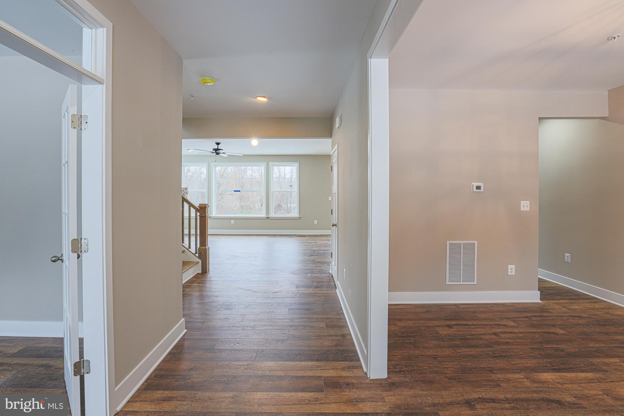 4712 Carroll Manor Road Baldwin, MD 21013 - Photo 6 of 69 a view of a hallway with wooden floor and staircase