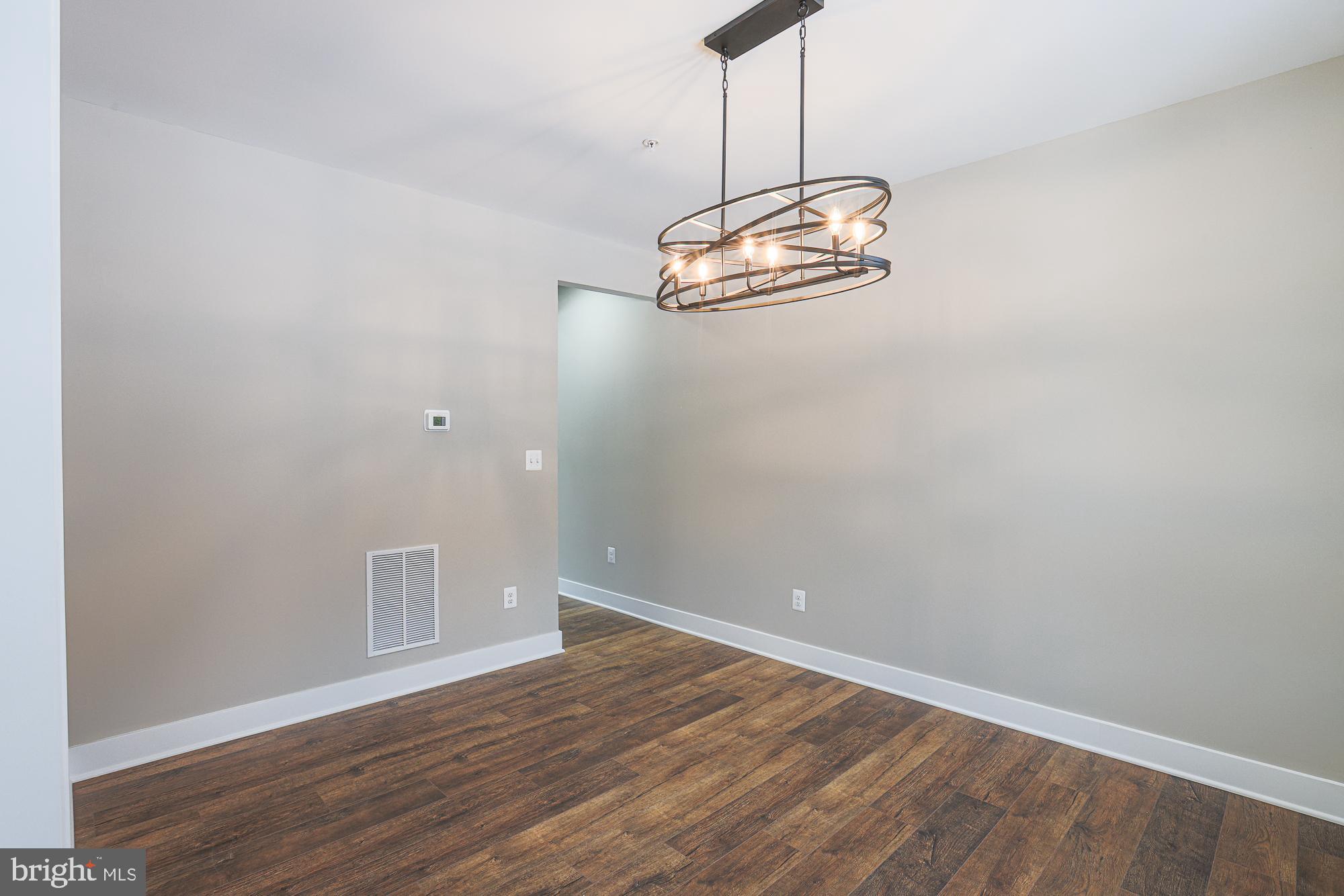 4712 Carroll Manor Road Baldwin, MD 21013 - Photo 7 of 69 a view of empty room with wooden floor