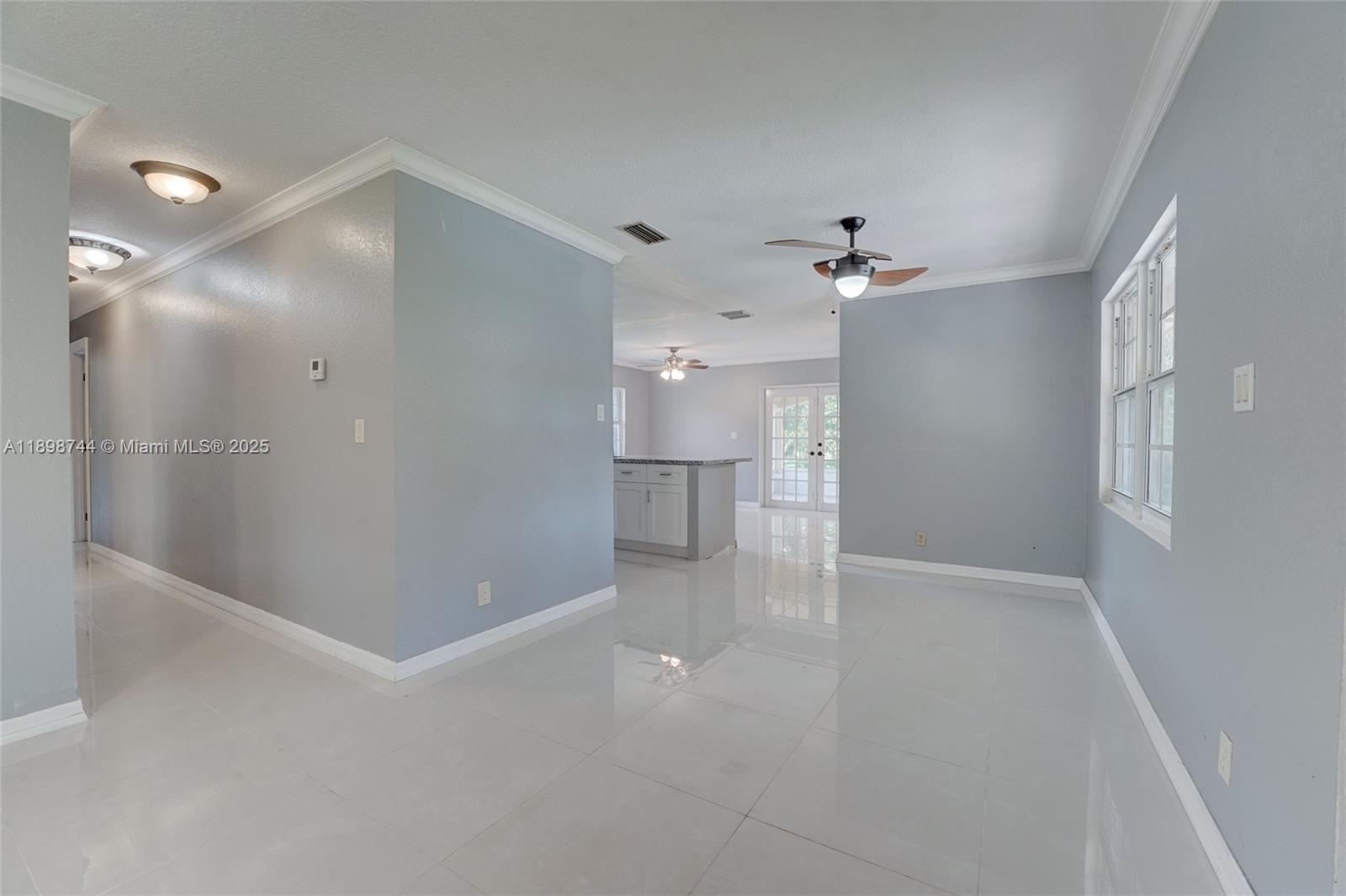 5130 Southwest 208th Lane Southwest Ranches, FL 33332 - Photo 11 of 53 wooden floor in an empty room with a bathroom