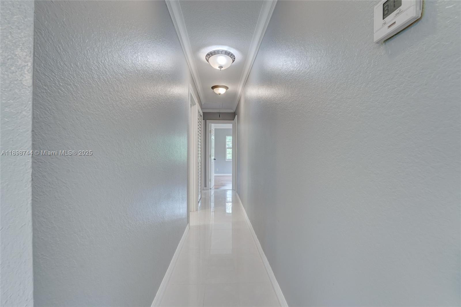 5130 Southwest 208th Lane Southwest Ranches, FL 33332 - Photo 24 of 53 a view of a hallway with wooden floor