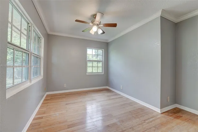 a view of an empty room with a window