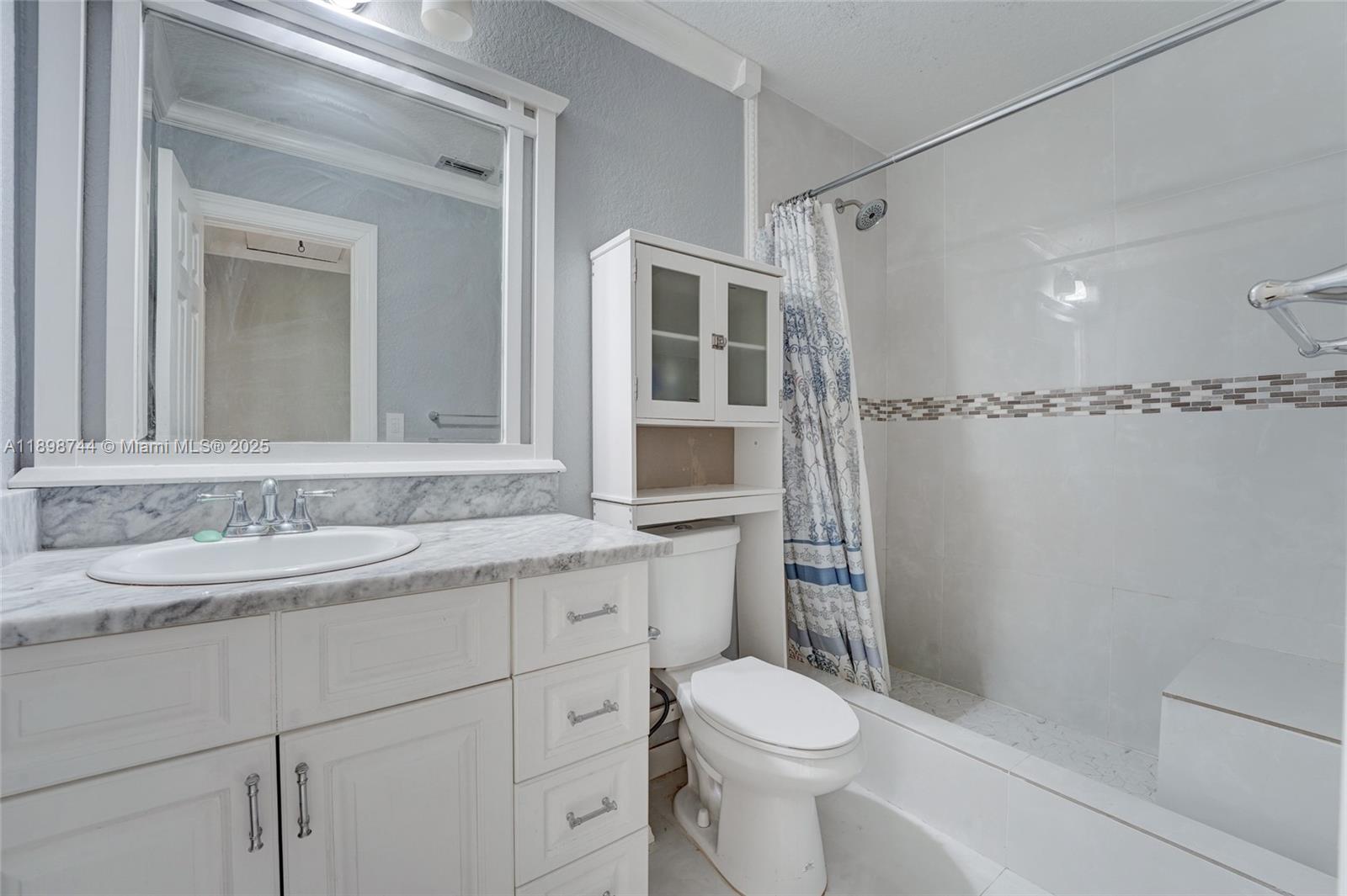 5130 Southwest 208th Lane Southwest Ranches, FL 33332 - Photo 39 of 53 a bathroom with a sink a toilet and shower