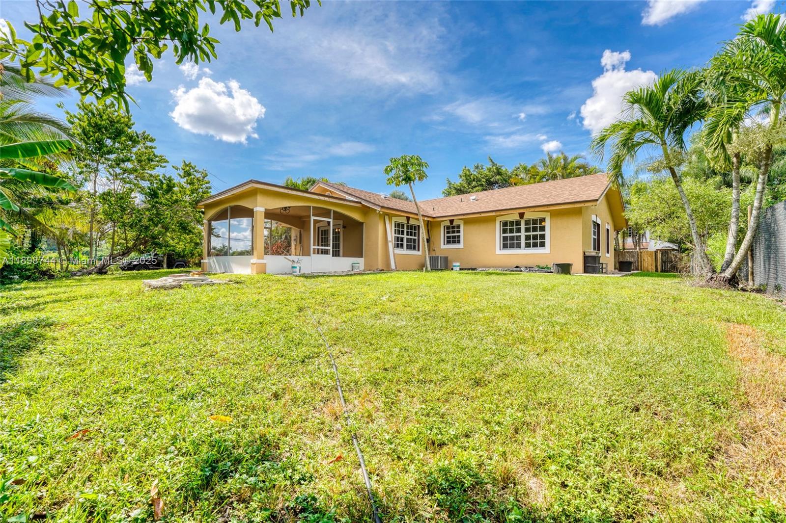 5130 Southwest 208th Lane Southwest Ranches, FL 33332 - Photo 43 of 53 a front view of a house with a garden