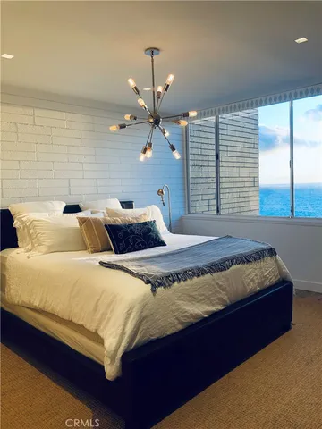 a bedroom with bed and window