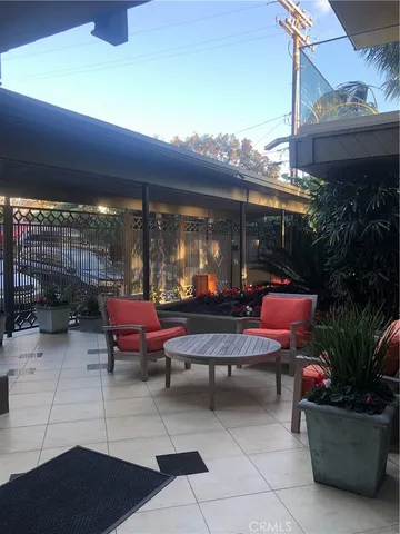 a outdoor space with lots of tables and chairs