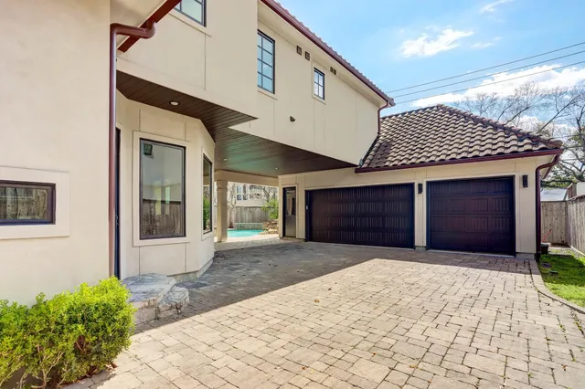 a front view of a house with a lots of green space