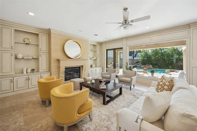 a living room with furniture kitchen view and a table